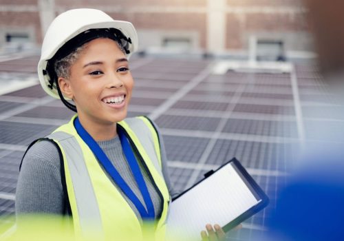 Solar panel, engineer and woman with digital tablet, mockup and discussing vision for engineering innovation on rooftop. Technician, solar energy and planning by woman share goal for renewable energy